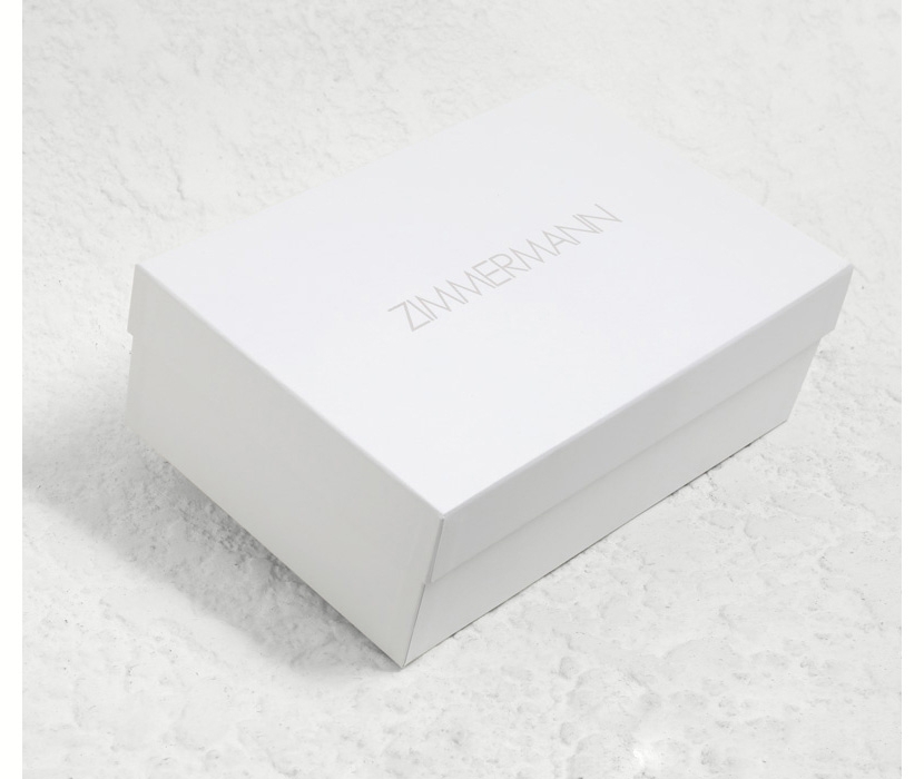 AN IMAGE OF WHITE SHOE BOX WITH ZIMMERMANN LOGO 