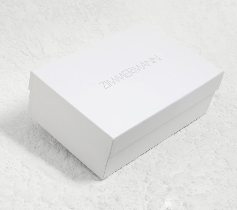 AN IMAGE OF WHITE SHOE BOX WITH ZIMMERMANN LOGO 