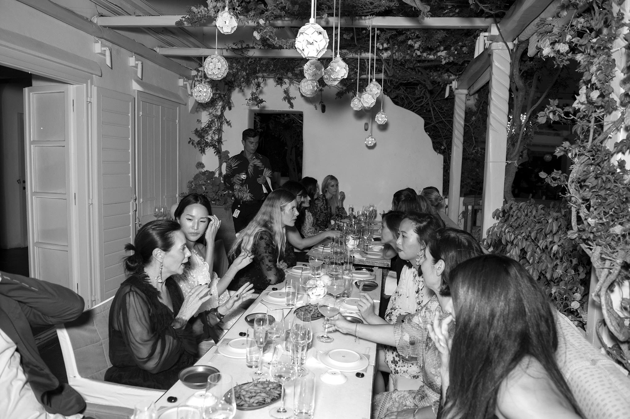 Our dinner party guests at the table chatting amongst themselves