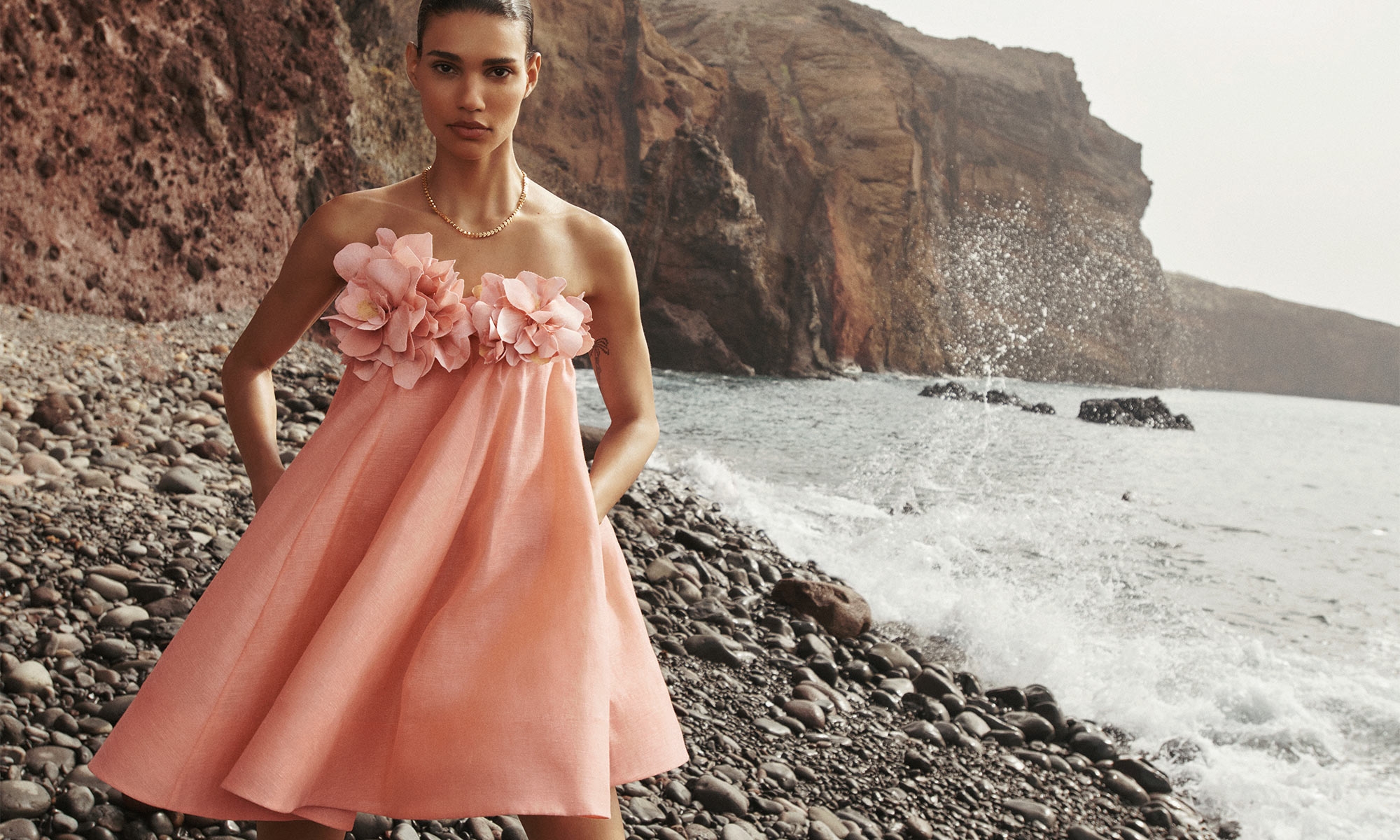 Model wears the Natura Strapless Mini in Coral and Zimmermann Laurel Necklace in Gold 