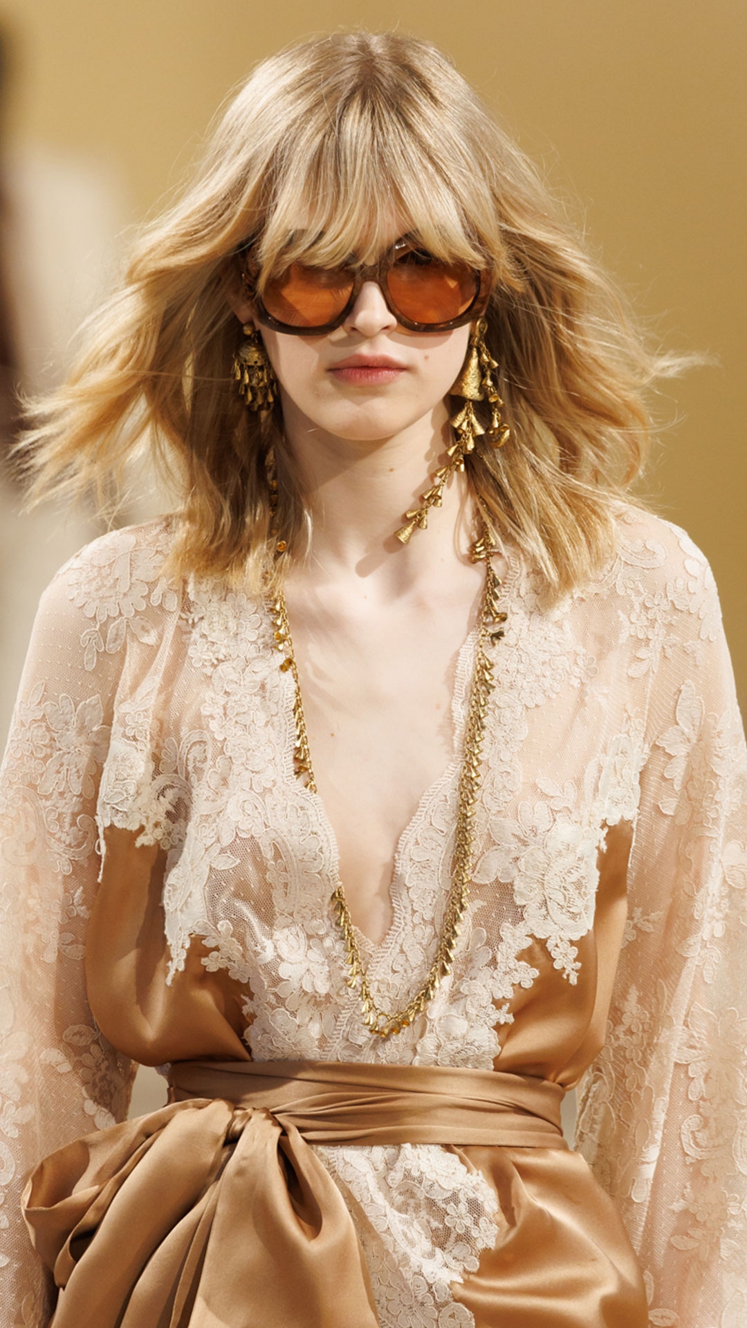 Look 2: Hypnotic Satin Wrap Dress in Biscuit, Hypnotic Silk Harem Pant in Biscuit, Whimsy Chandeliers in Antique Gold, Whimsy Single Earcuff in Antique Gold, Whimsy Necklace, Whimsy Charm Bracelet, Helix Sandal 75 in Wheat and Miranda Oversize in Orange 