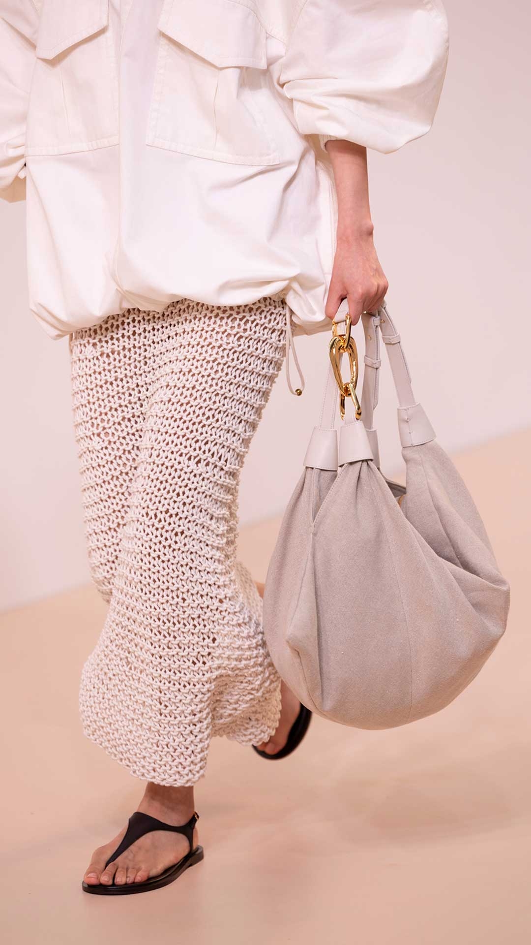 Look 22: Dawning Cargo Anorak in Ivory, Illuminate Hand Knit Skirt in Ivory, Ore Zebra Hoops in Gold/Black, Trampoline Hobo in Natural and Wild Sandal in Espresso 