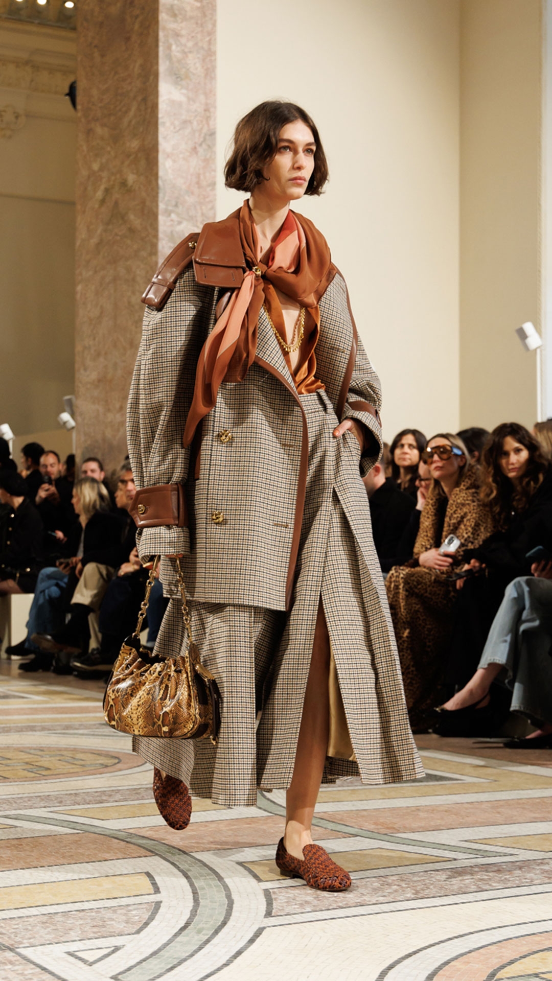 Look 30: Hypnotic Check Wool Trench in Cream/Beige Check, Hypnotic Satin Shirt in Tan, Hypnotic Check Wool Culotte in Cream/Beige Check, Whimsy Necklace, Cocktail Ring, Printed Silk Square 90, Helix Loafer in Pecan/Burgundy and Halcyon Clutch in Toffee 