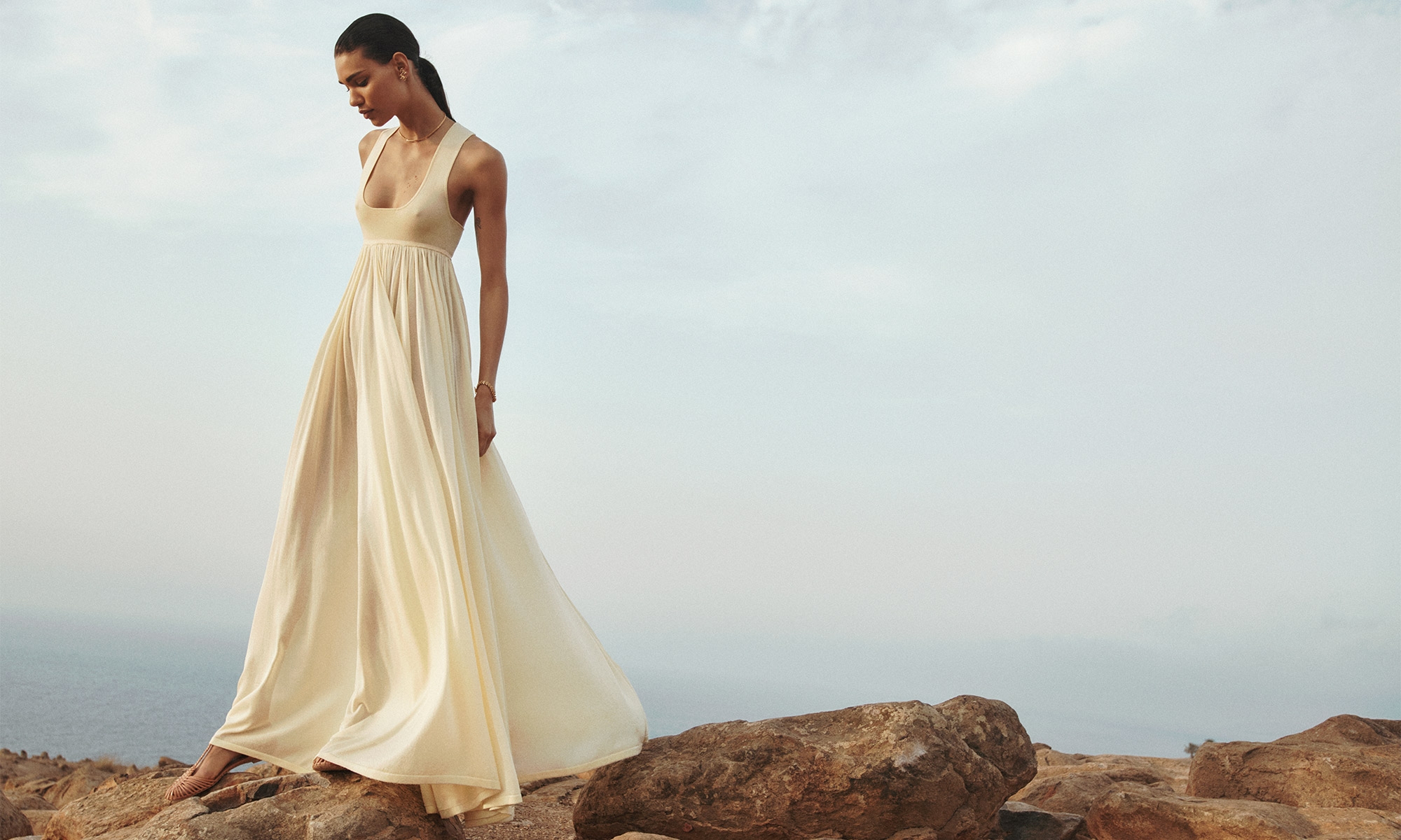 Model wears the Harmony Metallic Tank Dress in Lemon, Zimmerman Celesta Ballerina in Peach, Zimmermann Laurel Bracelet in Gold, Zimmermann Laurel Necklace in Gold and Zimmermann Laurel Hoops in Gold 