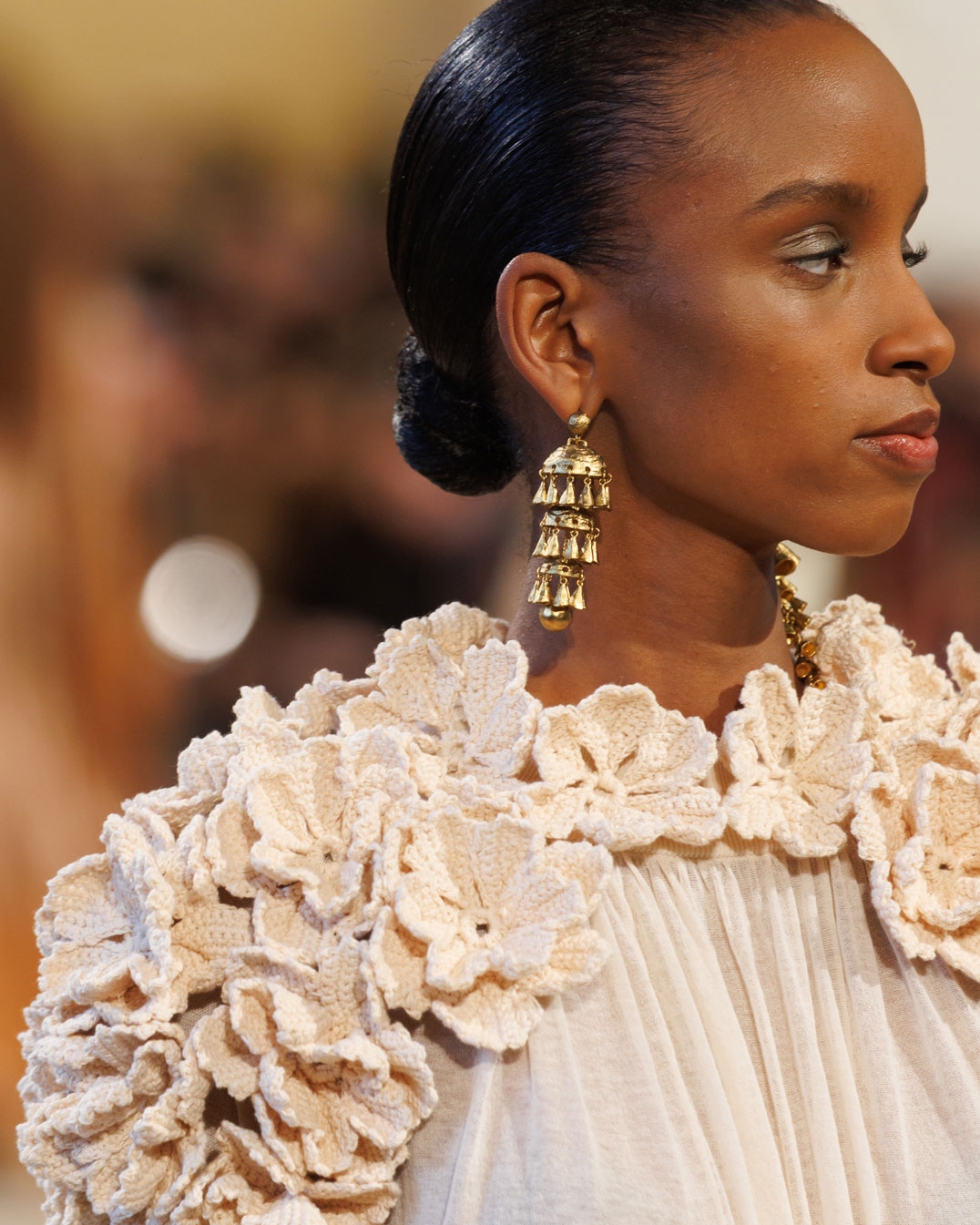 Look 29: Hypnotic Crochet Trim Gown in Chalk, Whimsy Drop Earrings in Antique Gold, Whimsy Single Earcuff in Antique Gold and Aspen Loafer in Ecru 