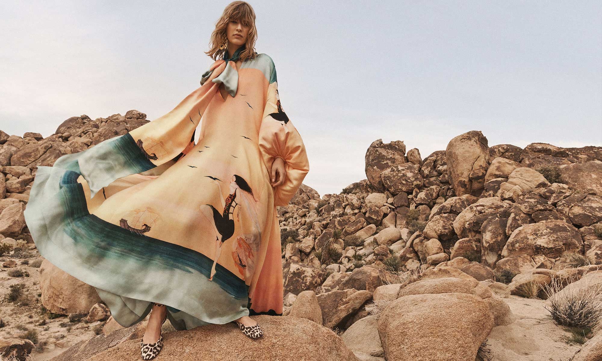 Model wears the Eden Billow Dress in Azura Sunset, Zimmermann Petal Chandeliers in Gold/Onyx and Zimmermann Gleam Ballerina in Leopard 
