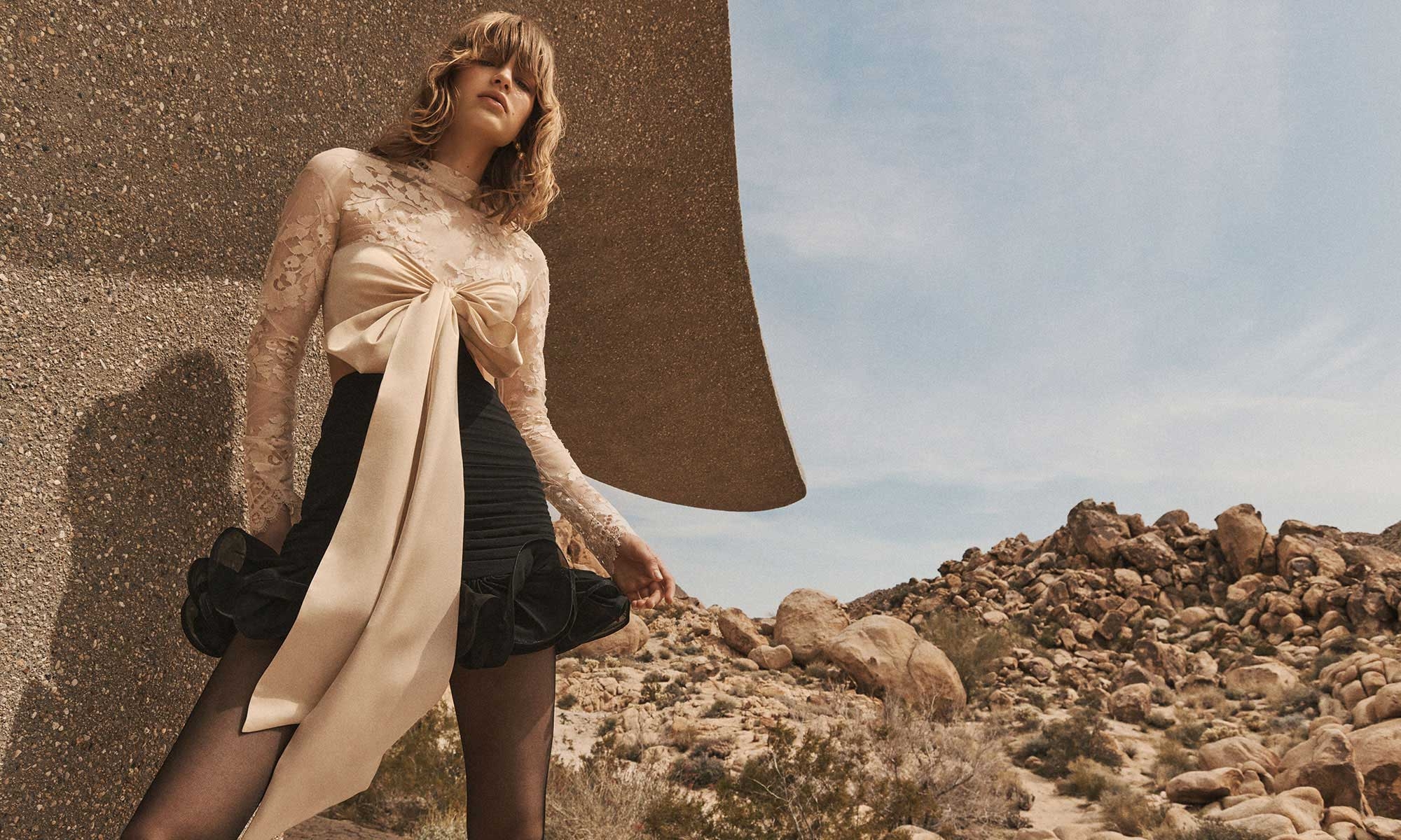 Model wears the Illustration Flounce Mini in Tea/Black and Zimmermann Pebble Drops in Gold 