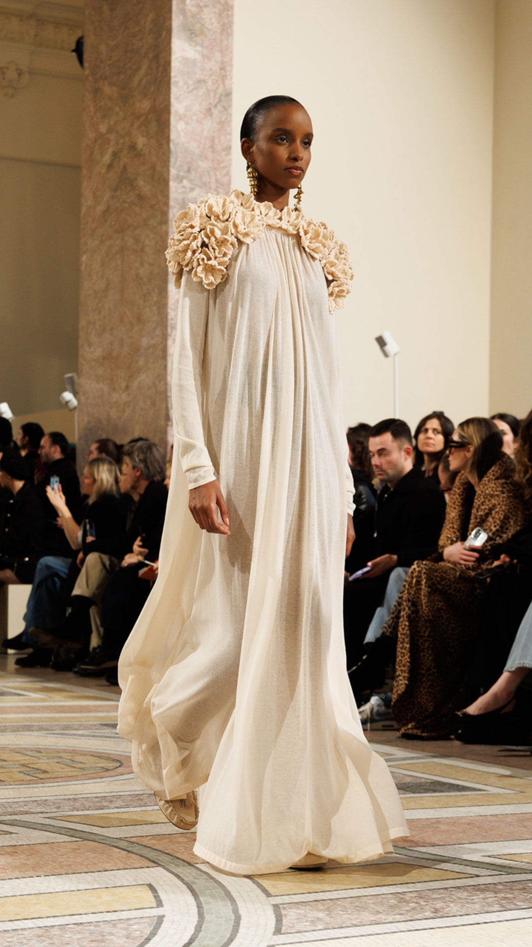 Look 29: Hypnotic Crochet Trim Gown in Chalk, Whimsy Drop Earrings in Antique Gold, Whimsy Single Earcuff in Antique Gold and Aspen Loafer in Ecru 