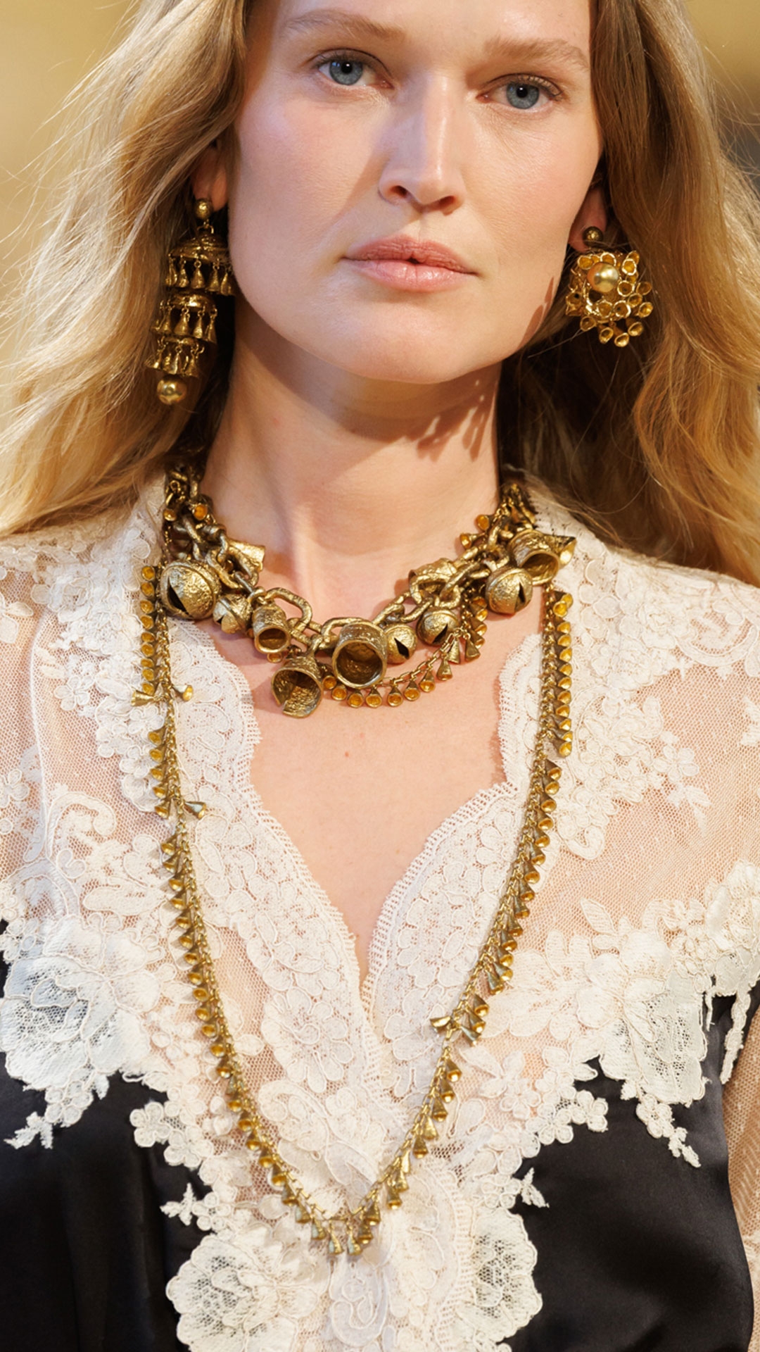 Look 44: Hypnotic Satin Wrap Dress in Black, Hypnotic Silk Harem Pant in Black, Whimsy Chandeliers in Antique Gold, Whimsy Charm Necklace in Antique Gold, Whimsy Necklace in Antique Gold and Helix Sandal 75 in Black 