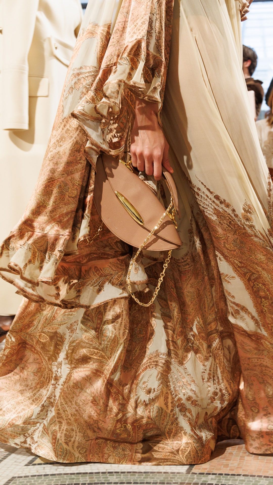 Look 24: Hypnotic Burnout Dress in Cream Paisley, Maisie Chandeliers in Antique Gold, Maisie Charm Necklace in Antique Gold, Helix Sandal 75 in Wheat and Wavelength Top Handle in Biscuit 
