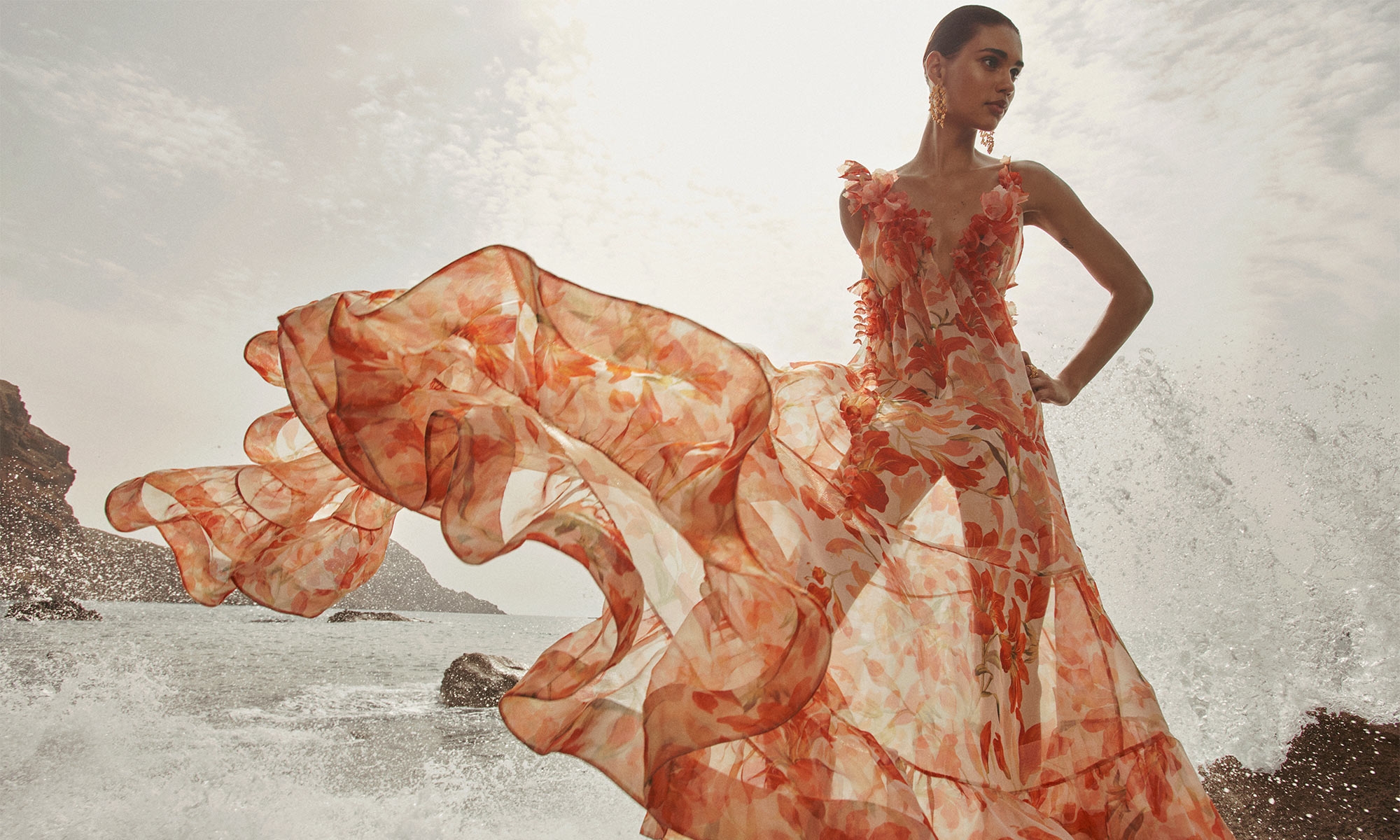 Model wears the Tranquillity Floral Strap Gown in Red Lily, Zimmermann Bloom Drop Earring in Gold/Green and Zimmermann Bloom Band Ring in Gold/Green 
