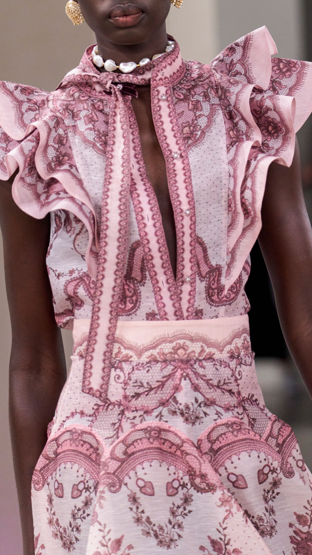 LOOK 6: CRUSH FRILLED FITTED BLOUSE IN PINK LACE PRINT, CRUSH FLARED MIDI SKIRT IN PINK LACE PRINT, ZIMMERMANN NOVA FRINGE STUDS IN GOLD, ZIMMERMANN WISH NECKLACE IN GOLD/PEARL MULTI CORD AND ZIMMERMANN PIXIE LOW SNEAKER IN IVORY 