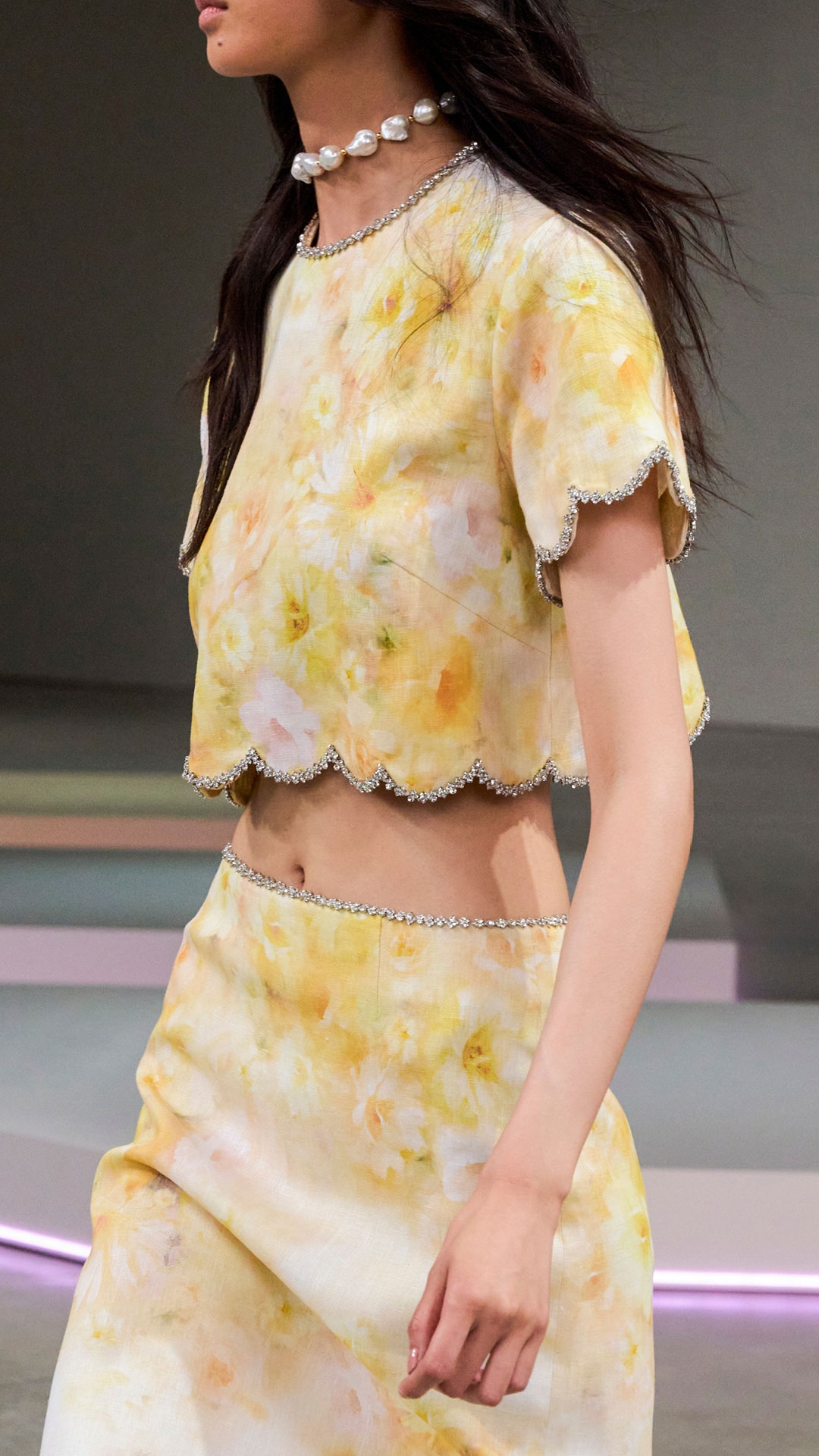 LOOK 26: CRUSH SCALLOPED TOP IN YELLOW FLORAL, CRUSH SCALLOPED MIDI SKIRT IN YELLOW FLORAL, ZIMMERMANN WISH NECKLACE IN GOLD/PEARL BLACK CORD, ZIMMERMANN TUX MULE IN BLACK AND ZIMMERMANN LIV SQUARE IN BLACK 