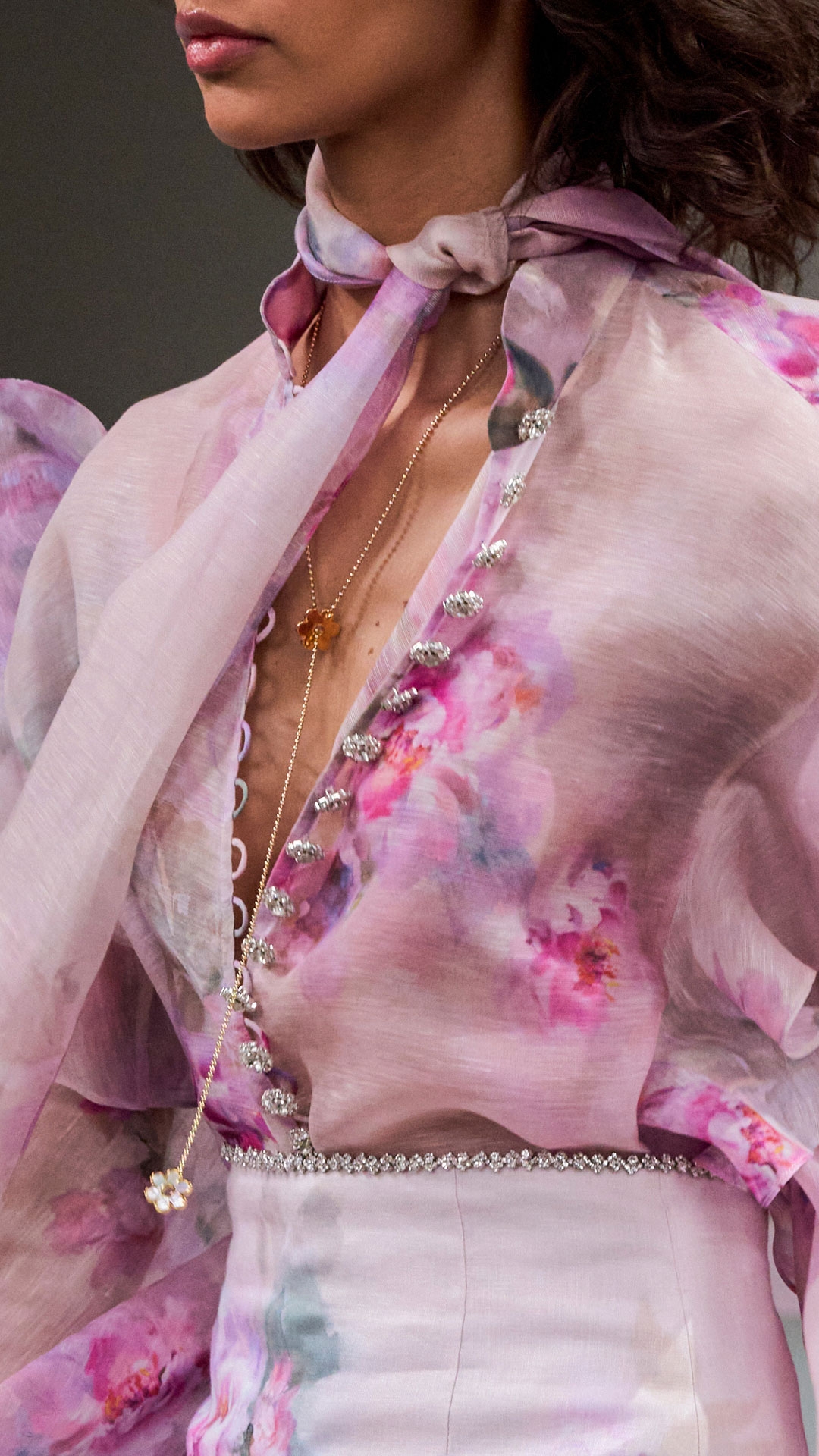 LOOK 23: CRUSH TIE NECK RUFFLE BLOUSE IN PINK FLORAL, CRUSH SCALLOPED MINI SKIRT IN PINK FLORAL, ZIMMERMANN BELLIS NECKLACE IN GOLD/BLUE AND ZIMMERMANN TUX MULE 65 IN BALLET PINK 