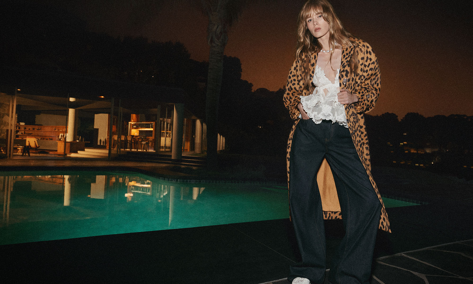 Model wears theCrush Straight Jean in Night Sky, Crush Lace Motif Tiered Top in Ivory, Crush Jacquard Barrel Coat in Leopard, Zimmermann Pixie Low Sneaker in Ivory and Zimmermann Wish Necklace in Gold/Pearl 