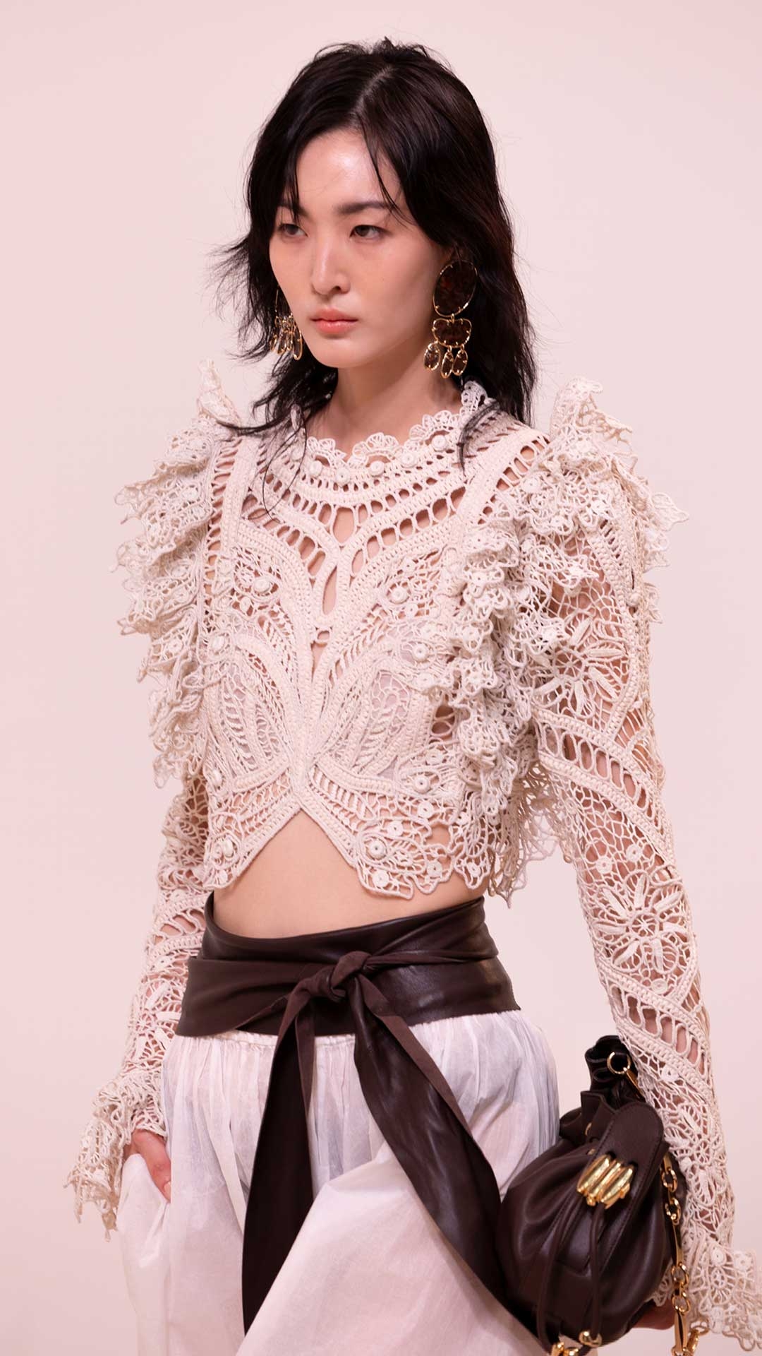 Look 12: Illuminate Cornelli Bodice in Cream, Dawning Paper Harem Pant in Ivory, Ore Chandeliers in Gold/Copper, Foam Wrap Belt in Coffee, Halcyon Clutch in Coffee and Wild Wedge 95 in Espresso 