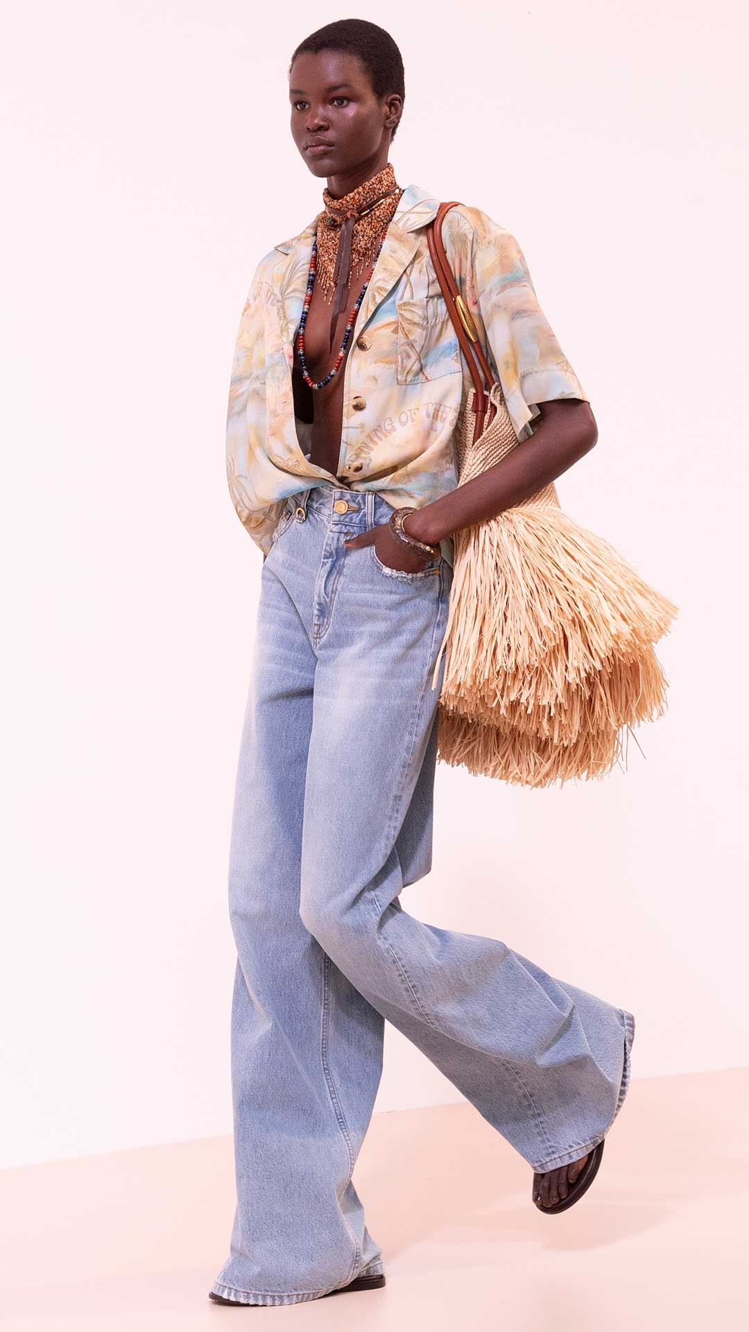 Look 9: Illuminate Short Sleeved Shirt in Blue Morning, Illuminate Relaxed Flare Jean in Sea Foam, Mellow Pearl Beaded Necklace, Mellow Stone Beaded Necklace, Mellow Stone Necklace, Slip Cuff, Goldentime Large Fringe Tote and Wild Sandal in Espresso 
