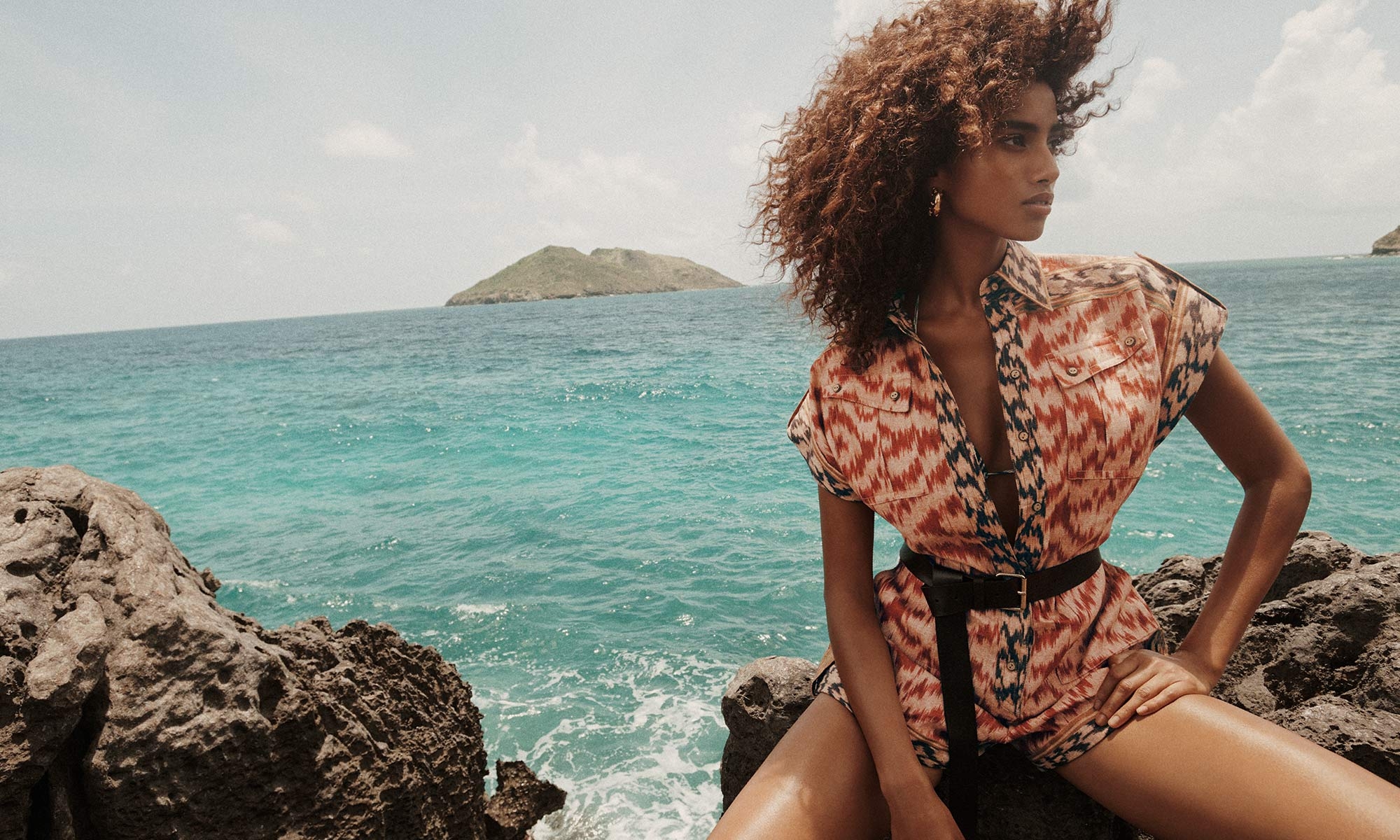 Model wears Wylie Pocket Playsuit in Red Ikat, Wylie Spliced Mini Tri in Spliced, Zimmermann Wish Hoops in Gold and Long Belt 40 in Black 