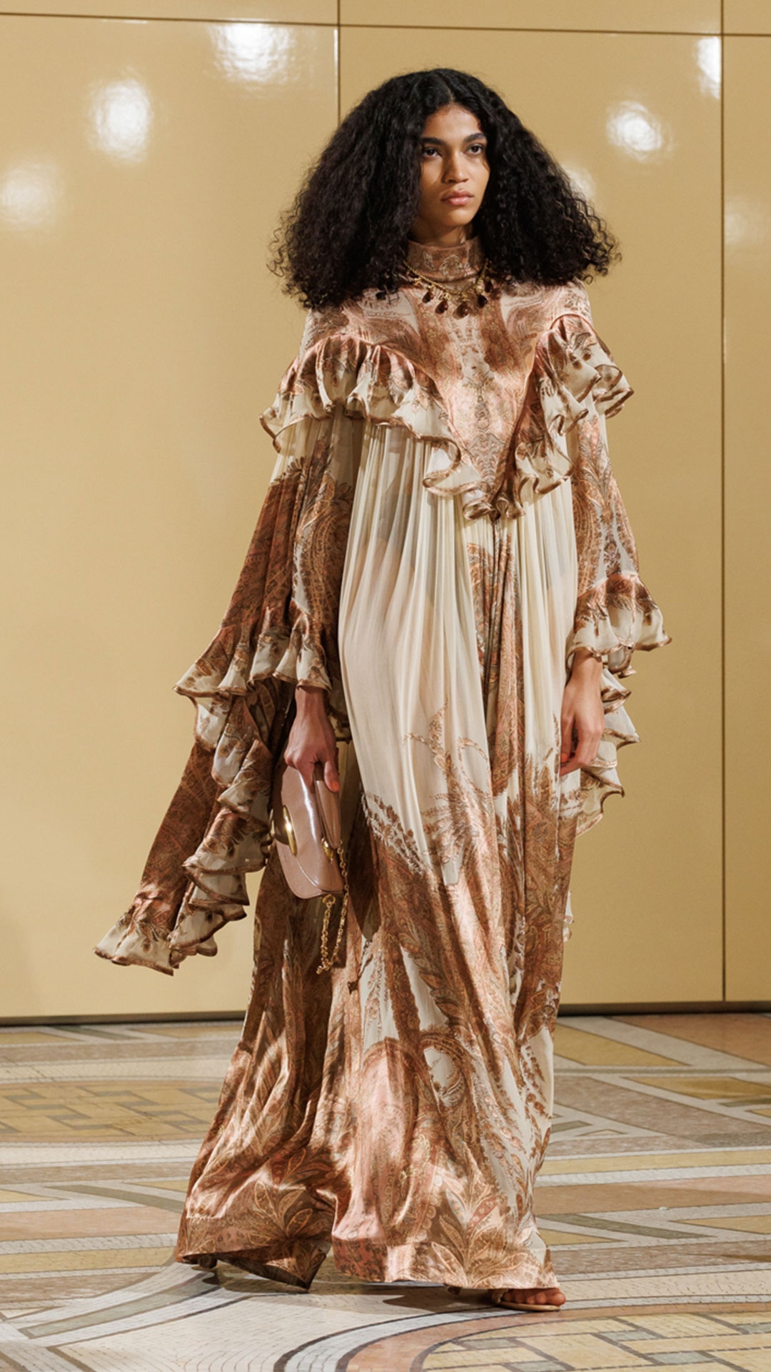Look 24: Hypnotic Burnout Dress in Cream Paisley, Maisie Chandeliers in Antique Gold, Maisie Charm Necklace in Antique Gold, Helix Sandal 75 in Wheat and Wavelength Top Handle in Biscuit 