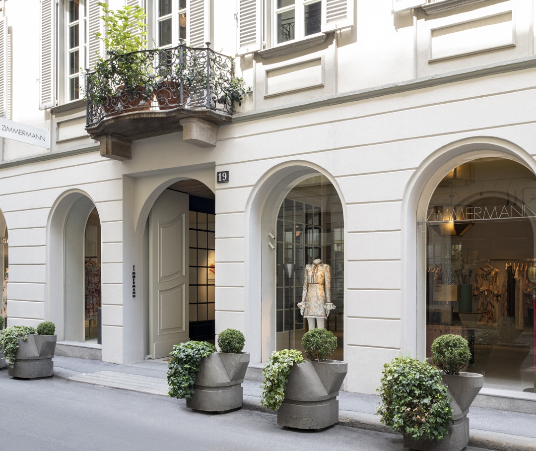 the exterior of our Paris store with green awning and traditional stone