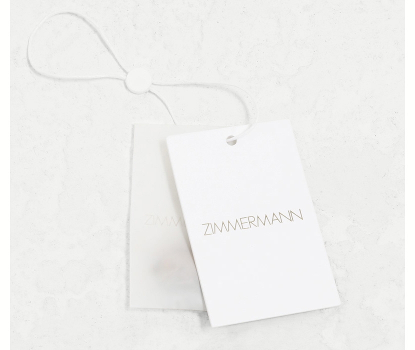 AN IMAGE OF WHITE SHOE BOX WITH ZIMMERMANN LOGO 