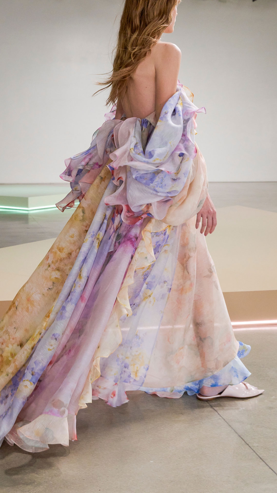 LOOK 43:  CRUSH STRAPLESS RUFFLE DRESS IN SPLICED FLORAL, ZIMMERMANN FLOW DROP EARRINGS IN GOLD, ZIMMERMANN NOVA LARGE STUDS IN GOLD/PEARL, ZIMMERMANN WISH NECKLACE IN GOLD/PEARL MULTI CORD AND ZIMMERMANN TUX MULE IN BALLET PINK 