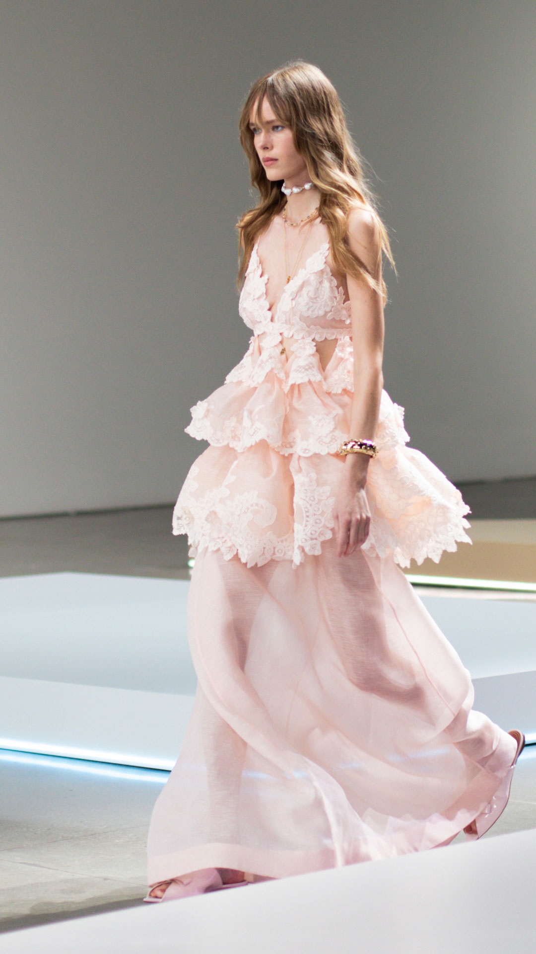 LOOK 28: CRUSH TIERED LACE MAXI DRESS IN PALE PINK, ZIMMERMANN WISH NECKLACE IN GOLD/PEARL BLACK CORD, ZIMMERMANN WISH CHAIN NECKLACE IN GOLD, ZIMMERMANN BELLIS NECKLACE IN GOLD/BLUE, ZIMMERMANN WISH CUFF IN GOLD AND ZIMMERMANN TUX MULE IN BALLET PINK 