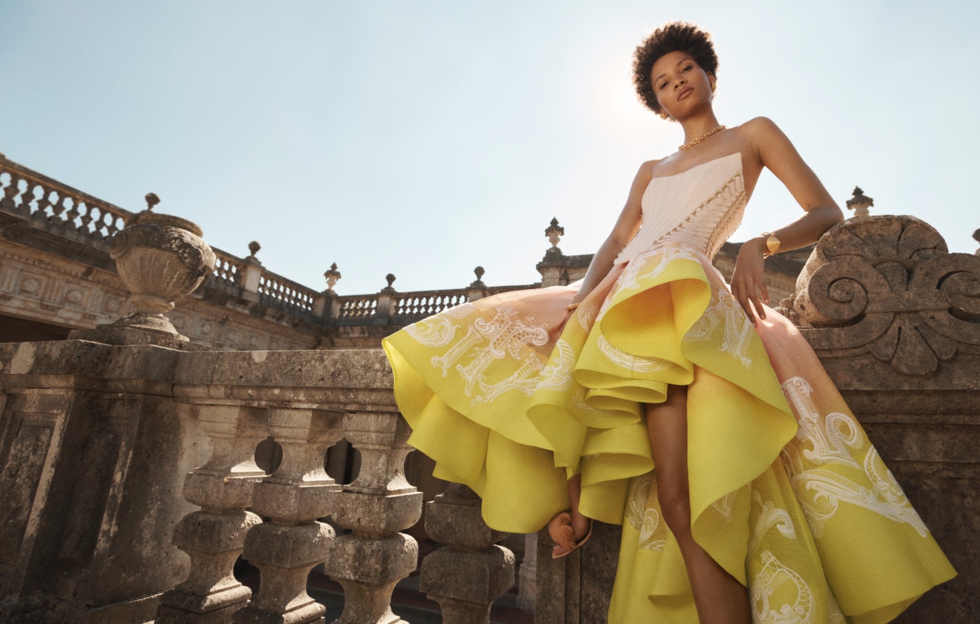 The Wonderland Lace Up Midi Dress in Sunset Ombre, Trinity Earring Cuffs in Gold, Medium Knife Edge Chain in Gold, Spiral Rope Cone Cuff in Gold, Twisted Rope Cuff in Gold and   Embellished Sandal 85 in Buff 