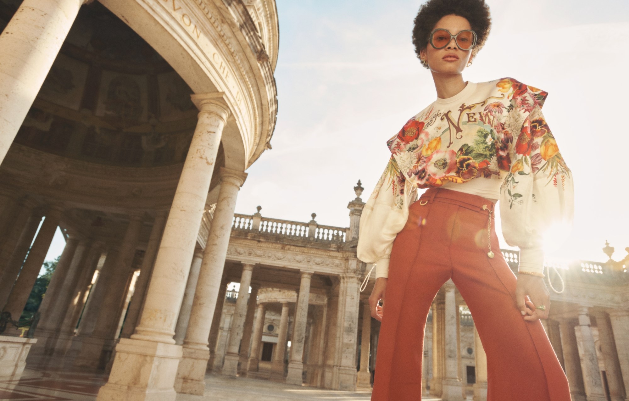 The Wonderland Billow Top in Bouquet Garden Floral, Wonderland Tailored Pant in Sienna, Candy Stripe Pave Heart Hoops in Gold/ Green, Twisted Rope Cuff in Gold and Zimmermann Tama Hexagon in Khaki  