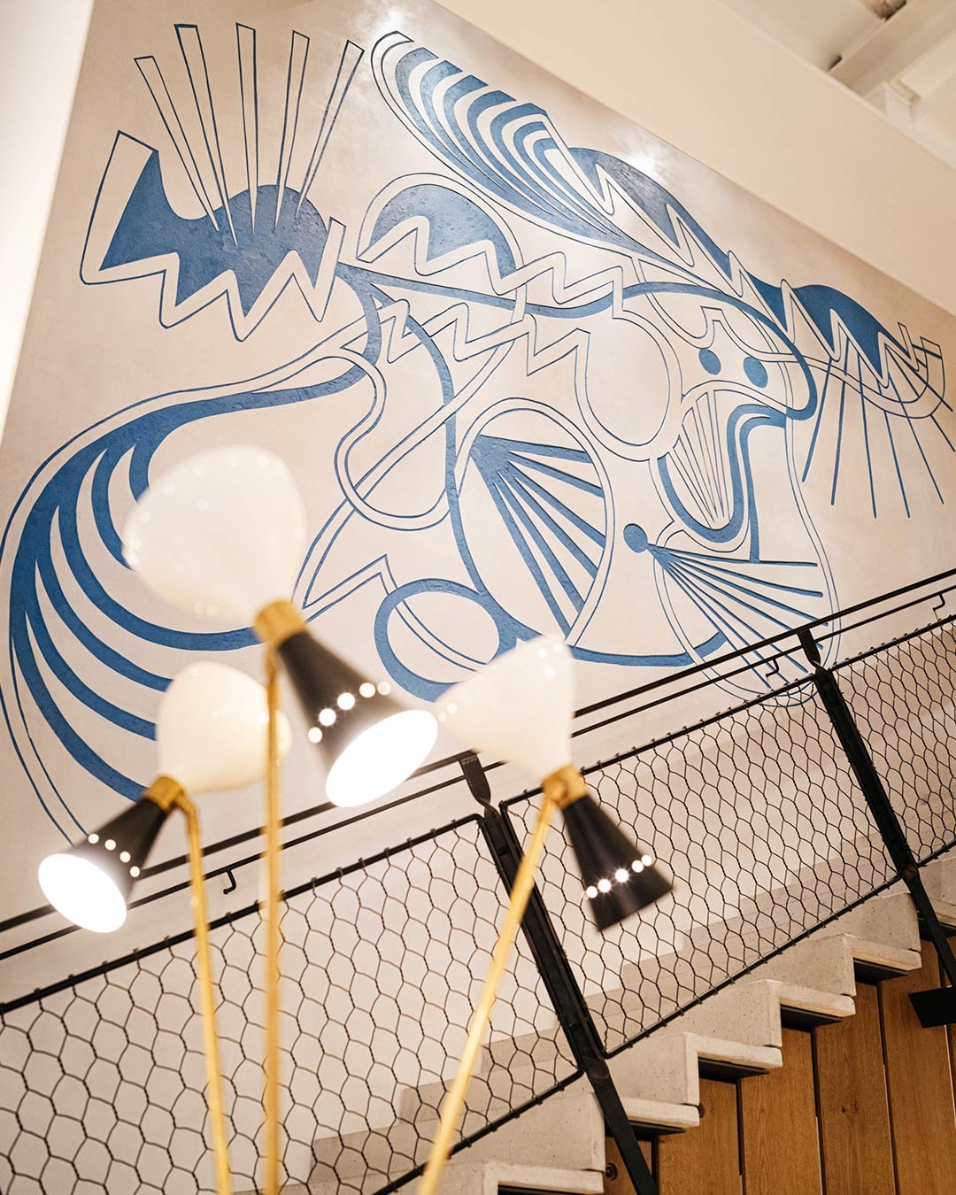 Sgraffito Mural commissioned by Australian artist Alasdair McLuckie and executed in white and blue Sgraffito by Barcelona artisans from Estucs Oriol Garcia. 