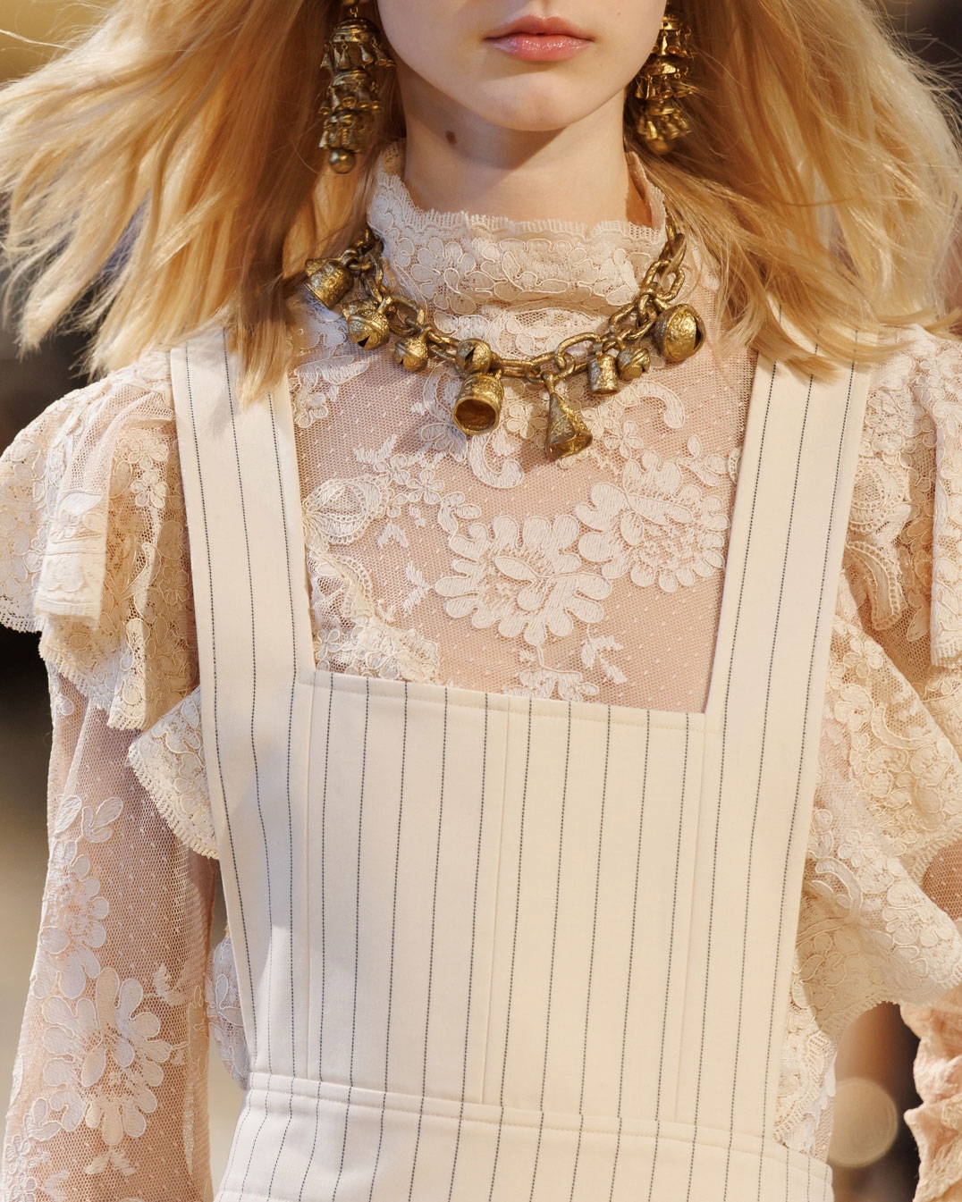 Look 7: Hypnotic Patched Lace Top in Cream, Hypnotic Pinstripe Apron Dress in Cream Pinstripe, Whimsy Chandeliers in Antique Gold, Whimsy Charm Necklace in Antique Gold, Helix Sandal 75 in Wheat and Halcyon Clutch in Ivory 