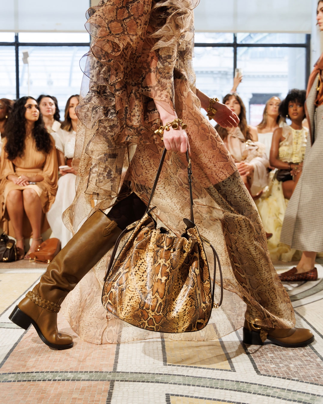 Look 32: Memento Billow Dress in Spliced Snake, Whimsy Chandeliers in Antique Gold, Whimsy Single Earcuff in Antique Gold, Whimsy Charm Bracelet in Antique Gold, Helix High Boot in Moss and Halcyon Large Bucket in Toffee 